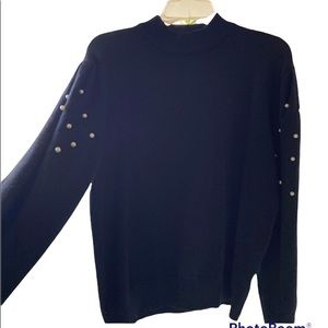 Black sweater with beautiful white pearls on the arms. NWOT